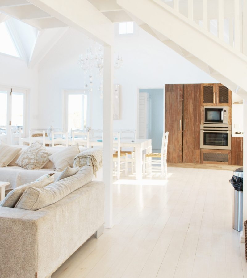 Spacious modern white interior of a modern home with bright natural light.